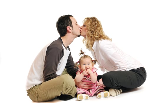 happy young family together in studio photo