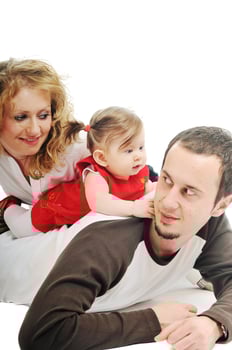 happy young family together in studio photo