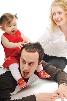 happy young family together in studio photo
