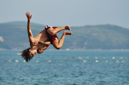 boy jump sea photo