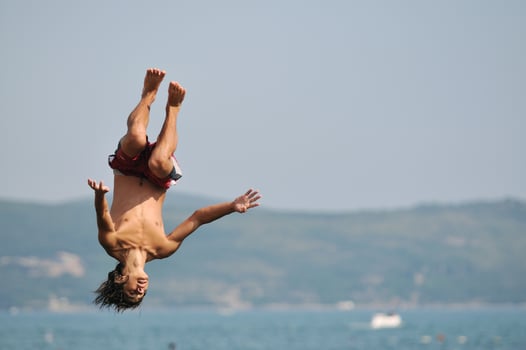 boy jump sea photo