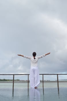 young woman relax on cloudy summer day photo