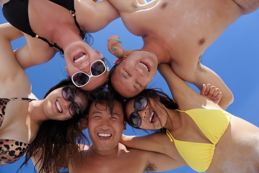 group of happy young people have fun on bach photo