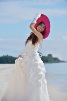 asian bride on beach photo
