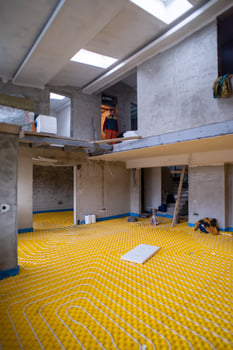 yellow underfloor heating installation with white pipes photo