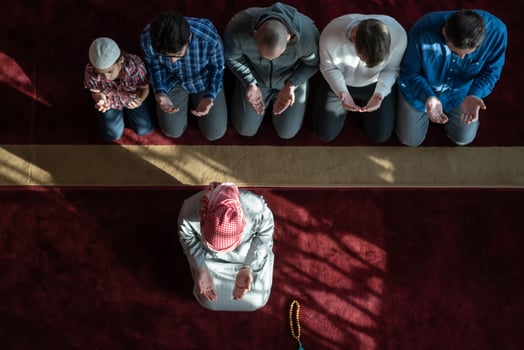 group of muslim people praying namaz in mosque. photo