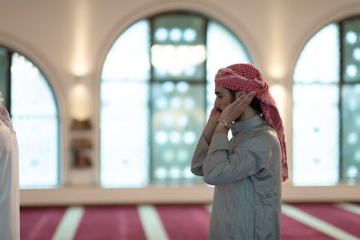 a Muslim begins to offer prayer by raising his hands in the air, a calm state in prayer photo
