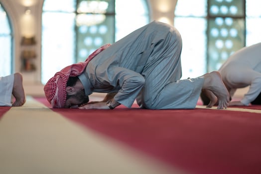 group of muslim people praying namaz in mosque. photo
