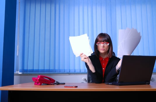 .angry businesswoman holding documents photo