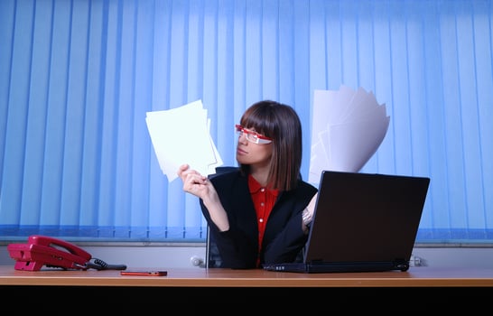 .angry businesswoman holding documents photo