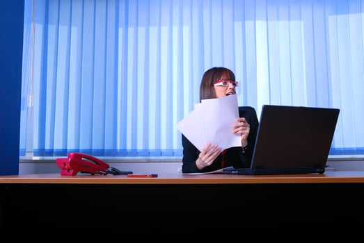.angry businesswoman holding documents photo