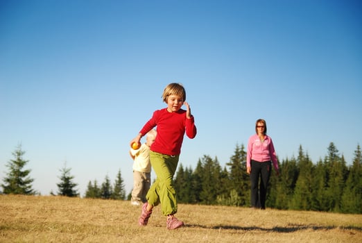 mother and kids having fun outside photo