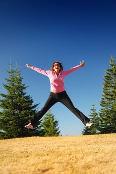 pretty girl jumping in a air photo