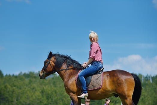 happy woman  ride  horse photo