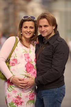 young pregnant couple have fun and relax photo