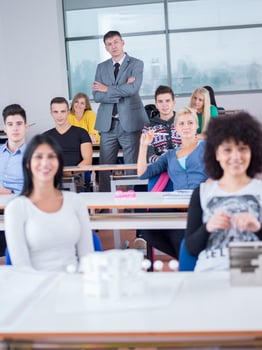 students with teacher  in computer lab classrom photo
