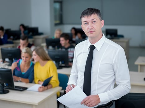 students with teacher  in computer lab classrom photo