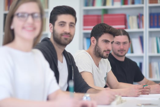 group of students study together in classroom photo