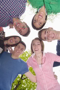 young friends staying together outdoor in the park photo