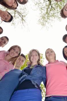 young friends staying together outdoor in the park photo