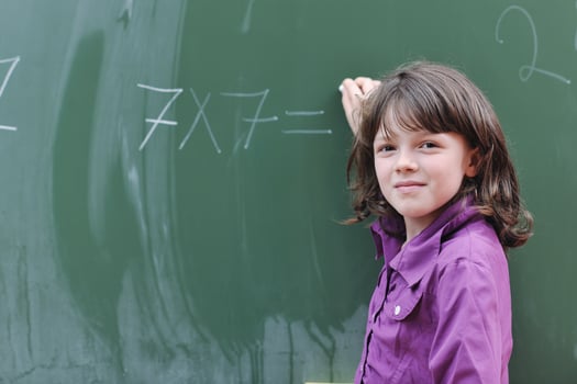 happy school girl on math classes photo