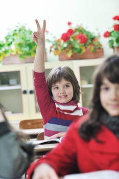happy child  in schoold have fun and learning leassos photo