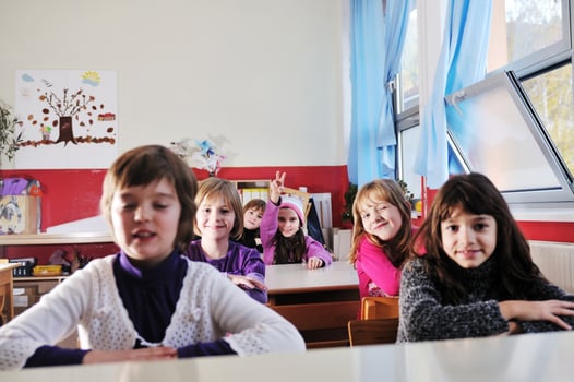 happy kids with  teacher in  school classroom photo