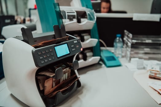 Sorted banknotes placed on the table after it is counted on the electronic money counting machine photo