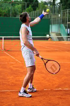 One man play tennis outdoors photo