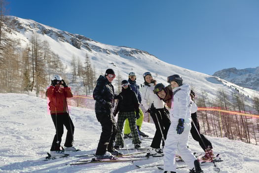 winter portrait of friends at skiing photo