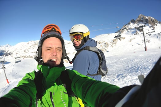 winter portrait of friends at skiing photo