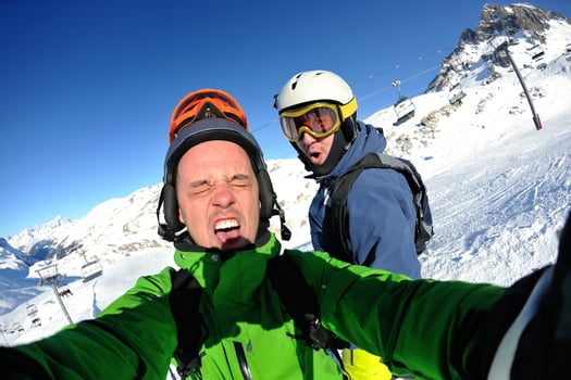 winter portrait of friends at skiing photo