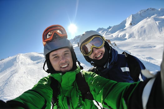 winter portrait of friends at skiing photo