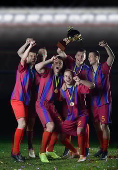 soccer players celebrating victory photo