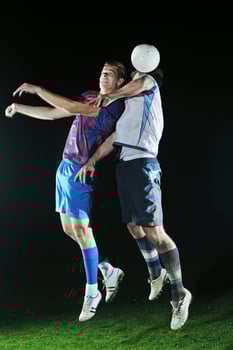 football players in competition for the ball photo