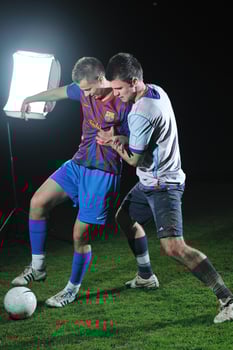 football players in competition for the ball photo