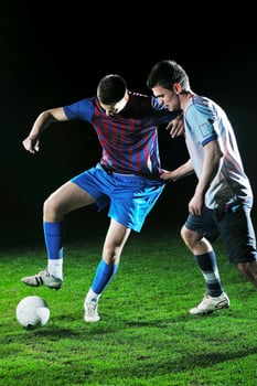 football players in competition for the ball photo