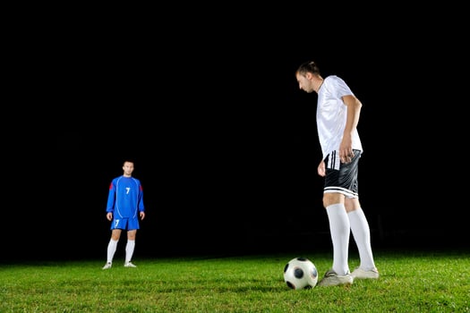 football players in action for the ball photo