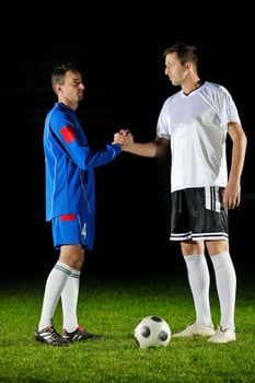 football players in action for the ball photo