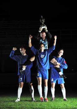 football players celebrating the victory photo