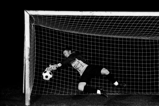 Man playing soccer photo