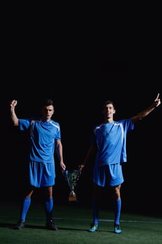 soccer players celebrating victory photo