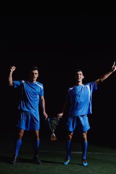 soccer players celebrating victory photo