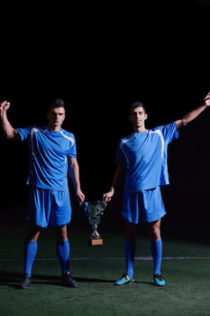 soccer players celebrating victory photo