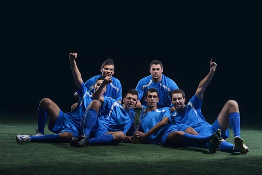 soccer players celebrating victory photo