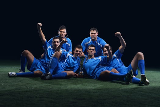 soccer players celebrating victory photo
