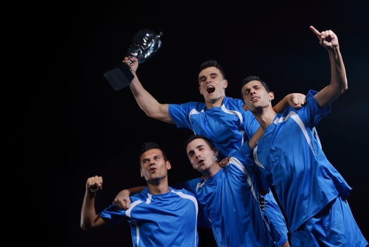 soccer players celebrating victory photo