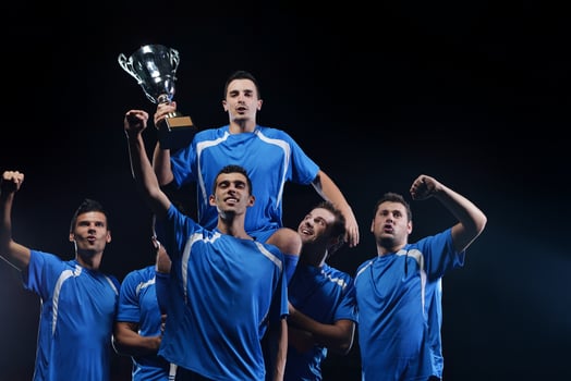 soccer players celebrating victory photo