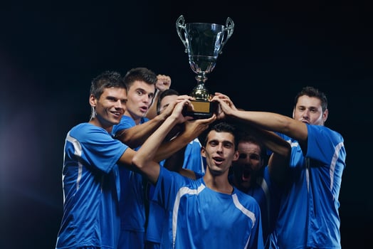 soccer players celebrating victory photo