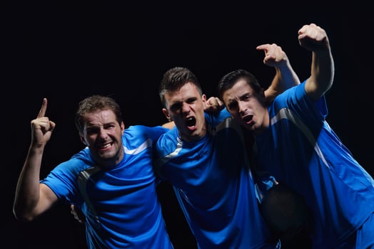 soccer players celebrating victory photo